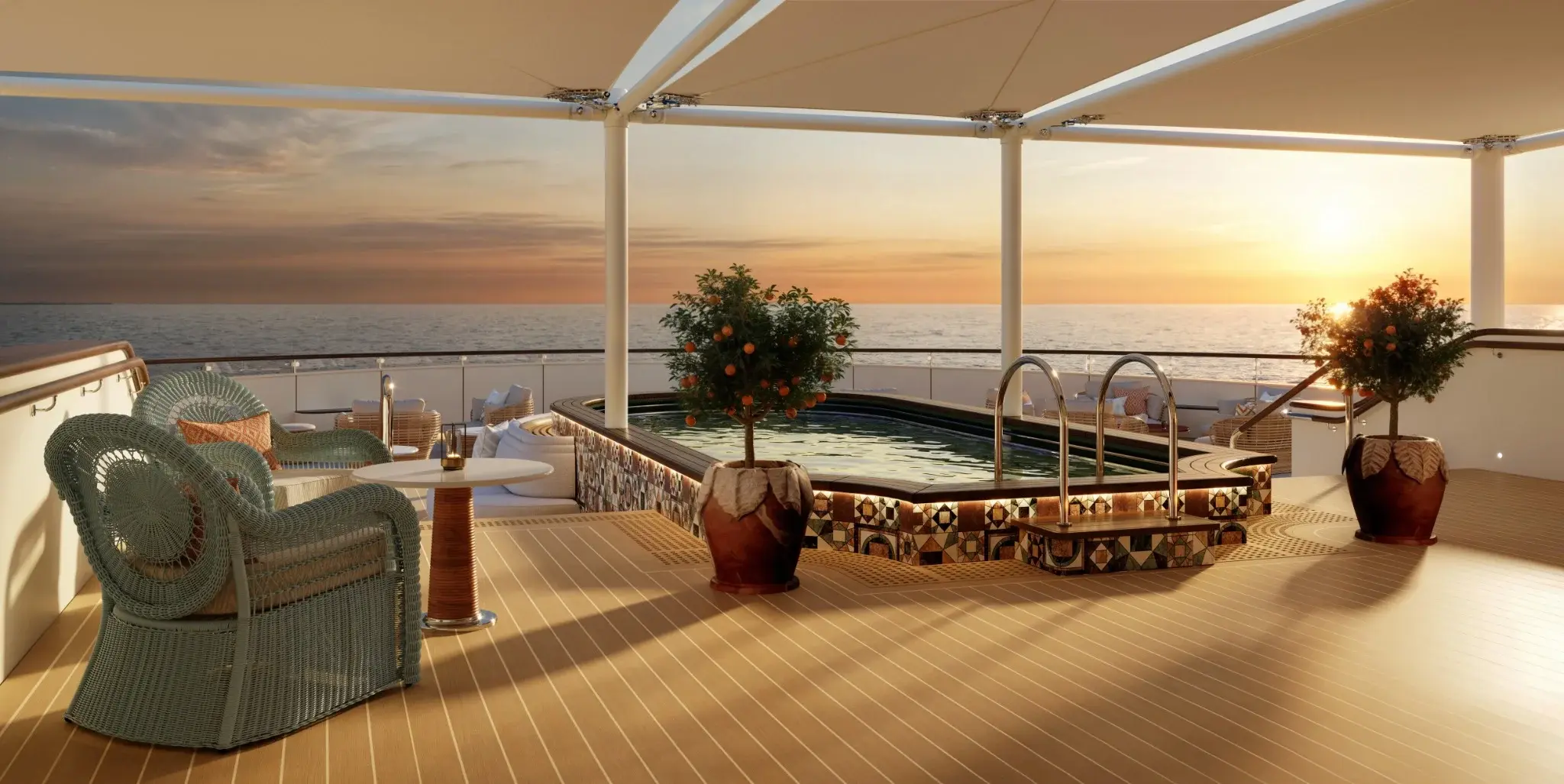 Jacuzzi con bordo in mosaico su misura di Morandistudio, su una terrazza affacciata sul mare al tramonto
